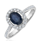 Blue Sapphire And Diamond Halo Ring Set In 18k White Gold